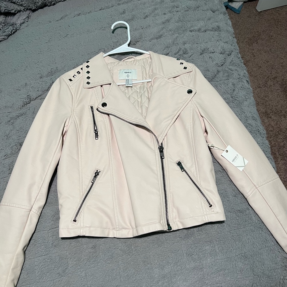 Light pink leather jacket from forever 21 . Never Worn. Size is a small